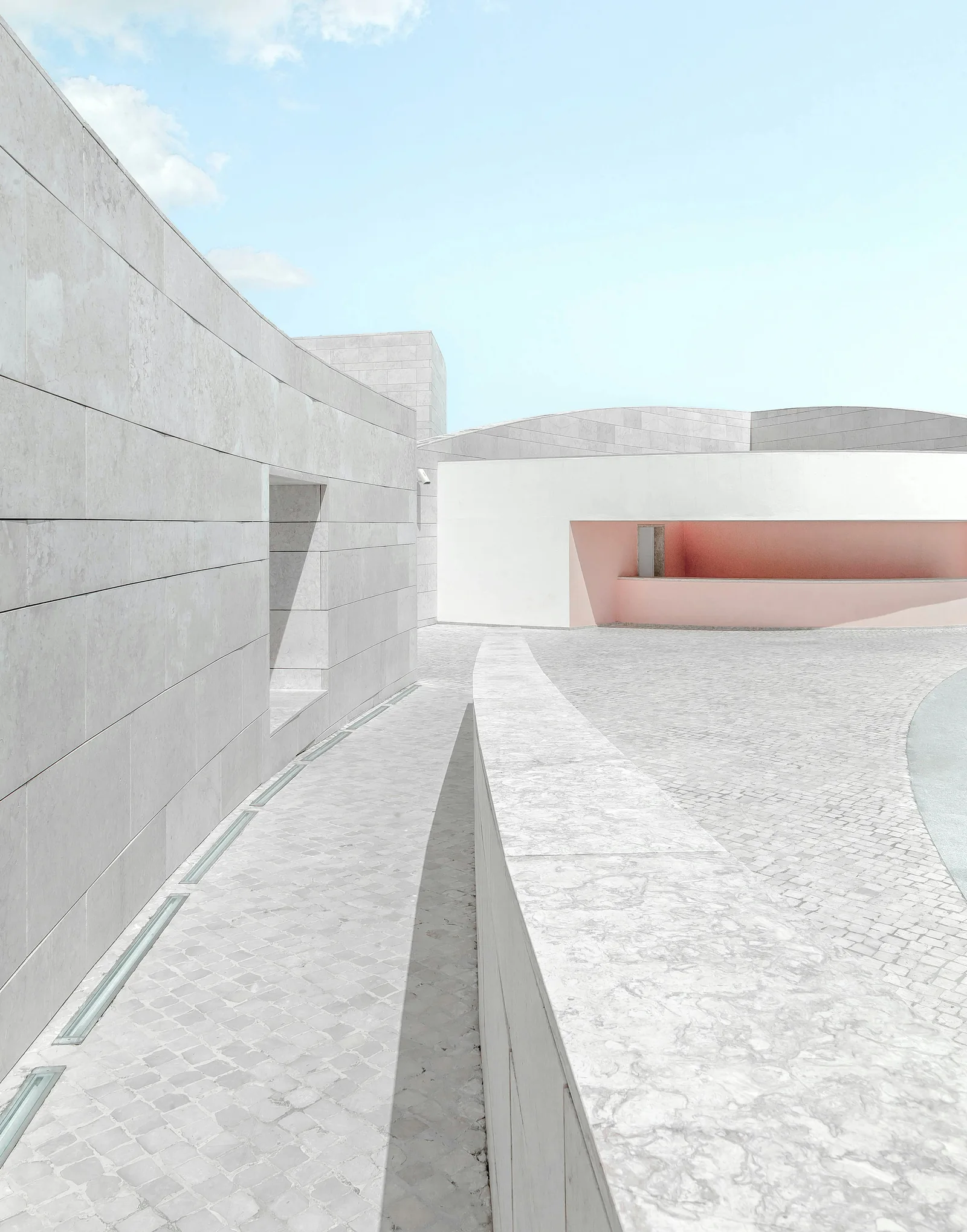 Curved pale concrete architecture at the Champalimaud Foundation in Lisbon.